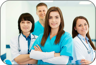 A group of confident healthcare professionals smiling, with a female nurse in blue scrubs standing in front.